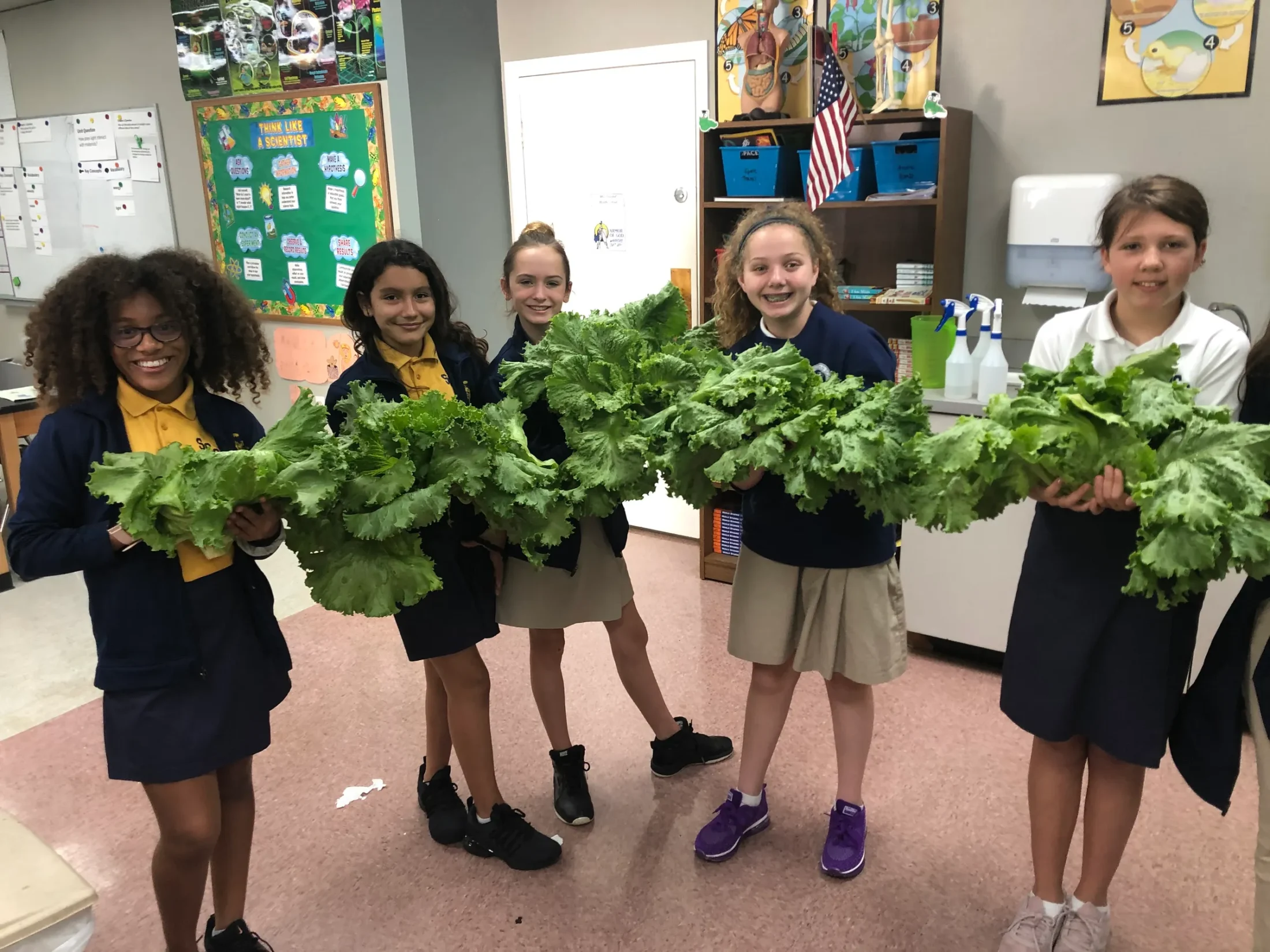 Kids holding greenery
